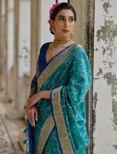 Teal Raw Silk Blend Saree With Ikat Weaving